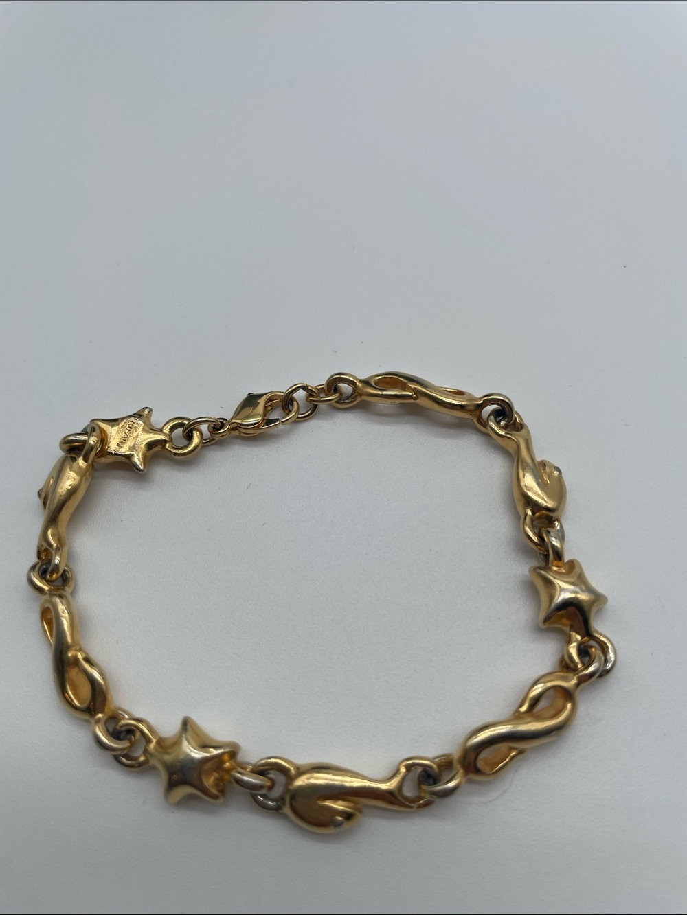 Trifari TM Gold Tone Star and Swirl Link Bracelet